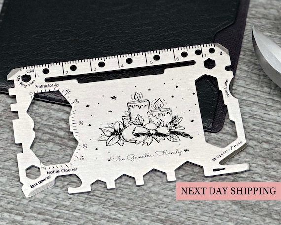 A wallet-sized survival card engraved with a candle motif — compact, gift-ready, and the kind of thing that feels special pulled from a box.