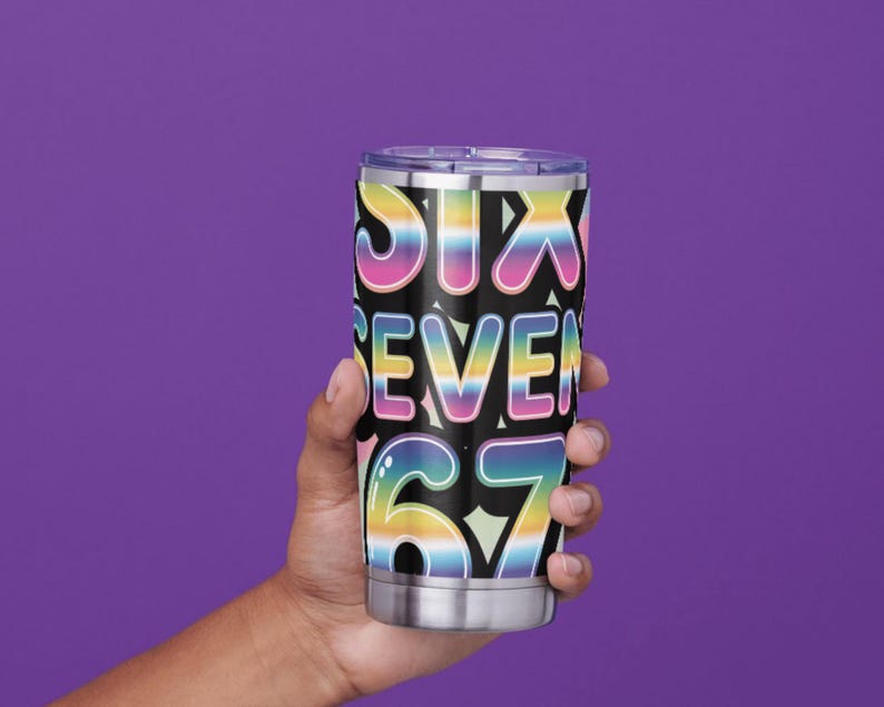 May include: A stainless steel tumbler with a black background and the words "SIX SEVEN 67" in a rainbow gradient font. The tumbler is held against a purple background.