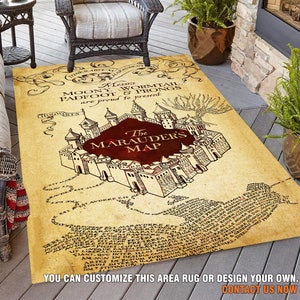 May include: A brown and beige area rug with a map of Hogwarts from the Harry Potter series. The map is titled "The Marauder's Map" and features the names of the Marauders: Moony, Wormtail, Padfoot, and Prongs. The rug is made in Turkey.