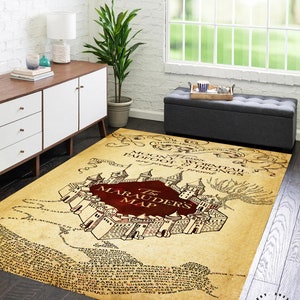 May include: A vintage-style area rug featuring a map of Hogwarts with the text "The Marauders Map" in red. The map is surrounded by text in a brown font. The rug has a brown border with the text "EST. 2023 MPR MOST POPULAR RUGS" in white.
