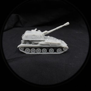 May include: A gray plastic model of a self-propelled howitzer, a type of artillery, with a long barrel and tracks.