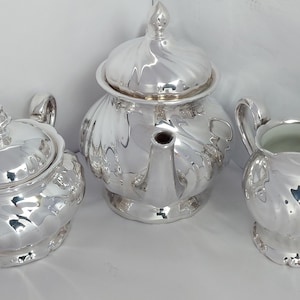 Thomas Porzellanfabrik, Silver on Porcelain Three Piece Tea Set - Dated 1925.
