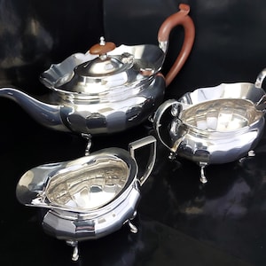Adolph Scott Limited, 1920&#39;s Three Piece Silver Plated Panelled & Hoof Footed Tea Set.