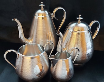 Mappin & Webb, 5127, Large Victorian Four Piece Machined Silver Plated Domed Tea Set, with "S" Mongramme on the right side - Circa 1890.