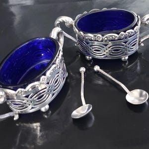 Miller Brothers 1903 Birmingham Hallmarked Sterling Pair of Salts With Alexander Macrae 1901 Birmingham Hallmarked Sterling Silver Spoons.