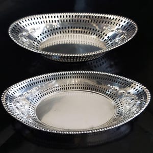 John Bishop Chatterley 1904 Birmingham Hallmarked, and James Dixon 1923 Sheffield Hallmarked, Pair Of Pierced Sterling Silver Oval Dishes.
