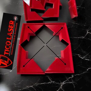 May include: Red plastic corner braces for woodworking projects. The braces are designed to create 90-degree angles and are used to join two pieces of wood together.