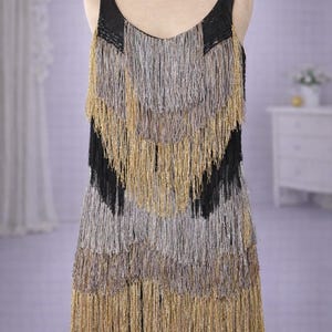 gold fringe dress eras tour Taylor Swift's 'Eras Tour': See All the Costumes