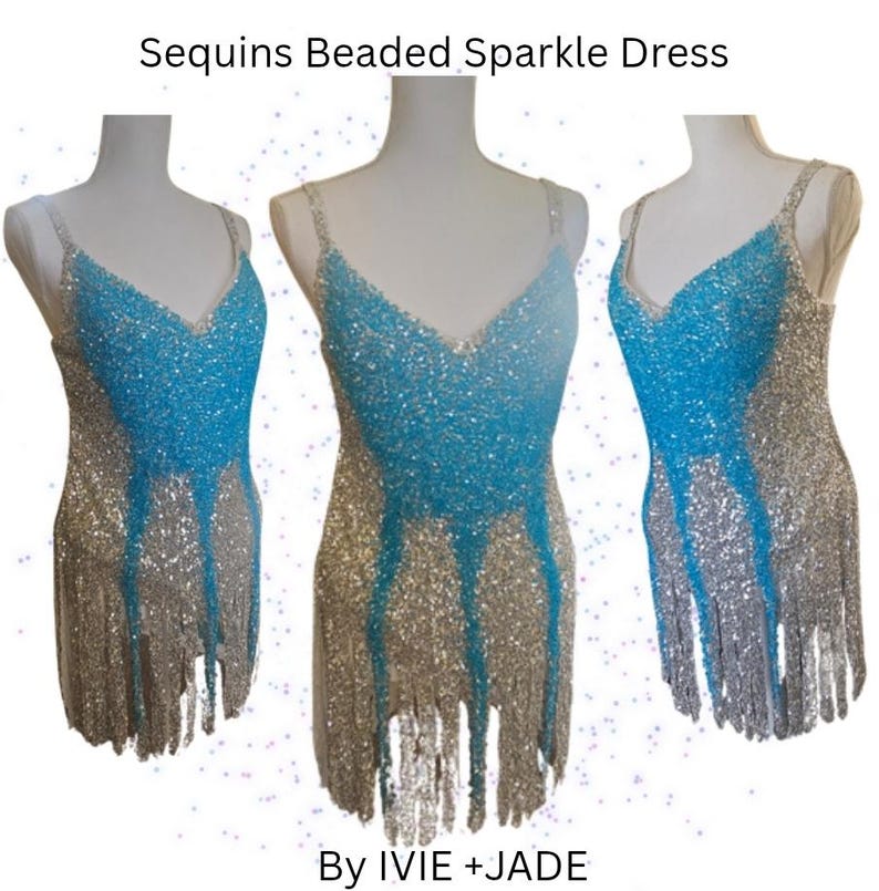 May include: A sleeveless dress featuring a V-neckline, covered in silver and bright blue sequins and beads. The garment has a fringe hemline and displays the text Sequins Beaded Sparkle Dress By IVIE +JADE at the top and bottom of the image.