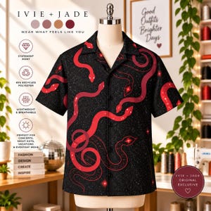May include: A short-sleeved button-down shirt in black featuring a red snake pattern and a subtle white speckled design. The shirt has a collared neckline and a front button closure. Text on the image includes IVIE + JADE, WEAR WHAT FEELS LIKE YOU, STATEMENT PRINT, 65% RECYCLED POLYESTER, LIGHTWEIGHT & BREATHABLE, and IVIE + JADE ORIGINAL EXCLUSIVE.