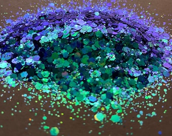 May include: A pile of iridescent blue and green glitter, perfect for crafting and adding sparkle to projects.