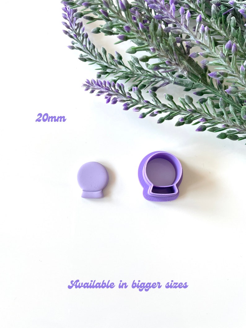 May include: Purple plastic cookie cutters in the shape of a snow globe. The smaller cutter is 20mm in diameter. Available in bigger sizes.