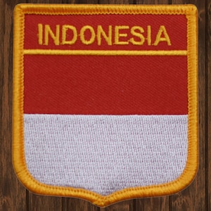May include: A red and white embroidered patch with a yellow border and the word "INDONESIA" in yellow lettering.