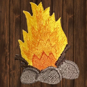 May include: Embroidered iron-on patch of a campfire with orange and yellow flames and gray logs.