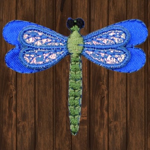 May include: Blue and green embroidered dragonfly iron-on patch.