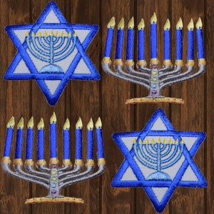 May include: Four embroidered iron-on patches featuring a blue Star of David with a menorah inside and a menorah with nine blue candles. The patches are on a wood background.