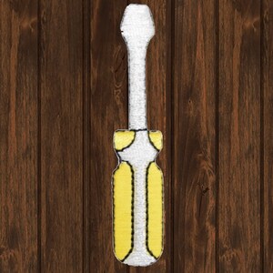 May include: A yellow and white screwdriver with a black outline. The screwdriver is on a brown wooden background.