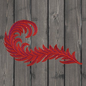May include: A red and purple feather design with a curved shape, embroidered on a wood background.