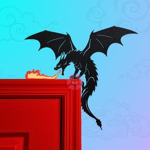 May include: A black silhouette of a dragon with wings spread wide, breathing fire, is perched on the top of a red door.