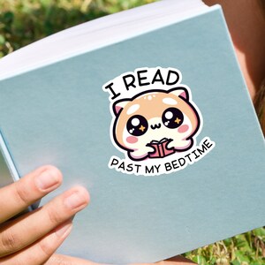 May include: A sticker with a cute cartoon animal reading a book. The text on the sticker says "I read past my bedtime".