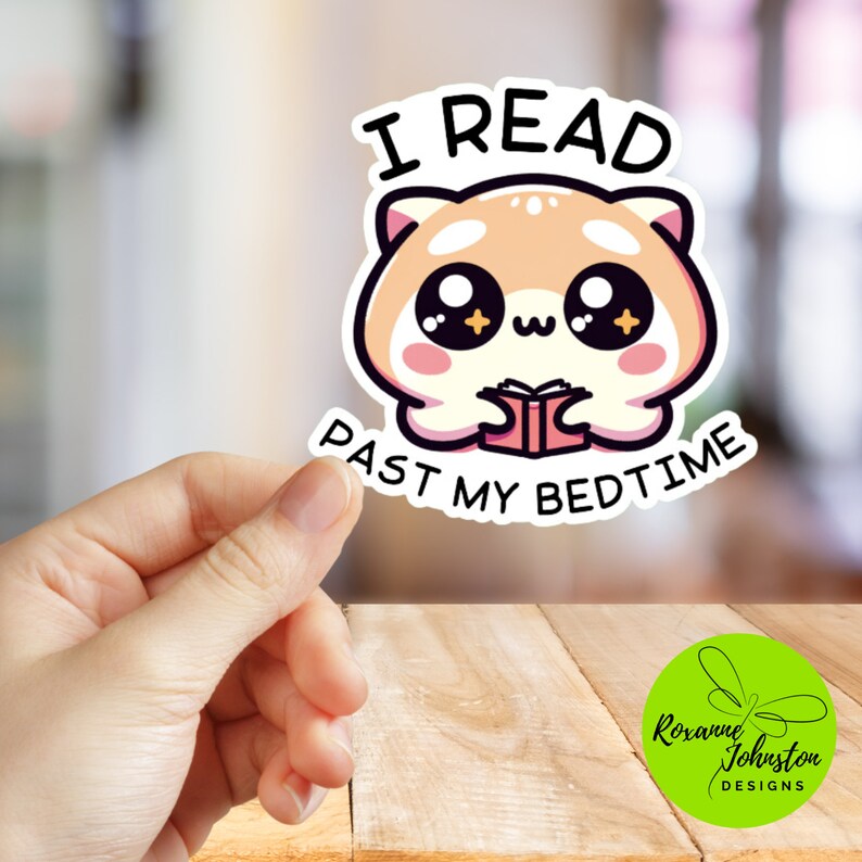 May include: A white sticker with a cartoon illustration of a red panda holding a book. The text "I read past my bedtime" is written in black letters around the panda.