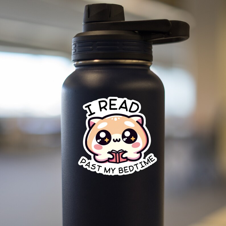 May include: A black stainless steel water bottle with a white sticker featuring a cartoon animal reading a book. The sticker says "I read past my bedtime".