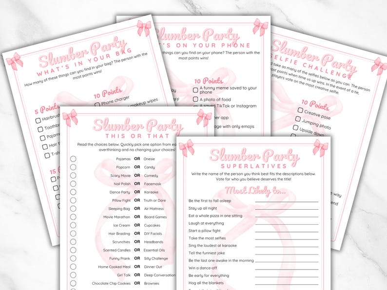 May include: Pink and white printable game cards for a slumber party. The cards have a pink ribbon design and include games like "What's in your bag?", "This or That", "Slumber Party Superlatives", and "Selfie Challenge".