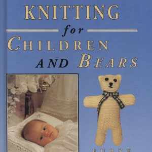 May include: Book cover with the title "TRADITIONAL KNITTING for CHILDREN AND BEARS" in yellow text on a blue background. The cover features a photo of a baby lying on a white blanket and a knitted teddy bear with a black and white checkered ribbon.