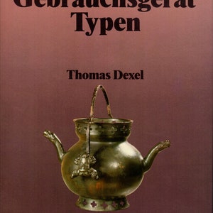 May include: A book cover with the title "Gebrauchsgerrat Typen" by Thomas Dexel. The cover features a vintage-style metal kettle with a handle and a decorative design.