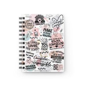 May include: A white spiral notebook with a colorful doodle design featuring the words "School Counselor" and inspirational quotes. The doodles include hearts, stars, rainbows, and a globe.