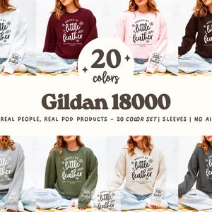 May include: An image displaying a selection of Gildan 18000 sweatshirts in 20 colours. Each sweatshirt has the text "Mocks by little feather" on the front and sleeve. The image showcases the variety of colours and the design of the product.