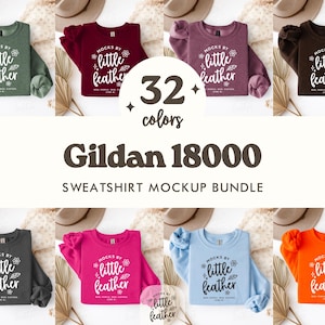 May include: A mockup bundle of Gildan 18000 sweatshirts in various colors, including green, burgundy, purple, and brown. Each sweatshirt displays the text "mocks by little feather". The image also shows the text "32 colors" and "Sweatshirt Mockup Bundle".