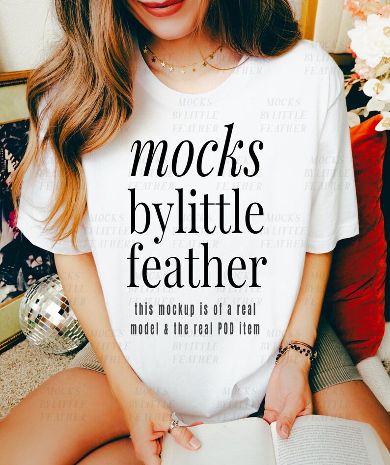 May include: White t-shirt with black text that reads "mocks bylittle feather" and "this mockup is of a real model & the real POD item".