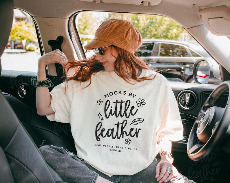 Comfort Colors 1717 Mockup in the color Ivory featuring a T-shirt (Tee) worn by a Real Model inside a car — No AI. Trendy and aesthetic design perfect for Etsy, Shopify, and other Print on Demand (POD) platforms. High-quality mockup created by MocksByLittleFeather.