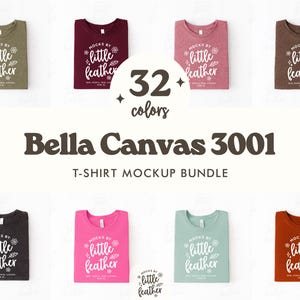 May include: A mockup bundle of Bella Canvas 3001 t-shirts in various colors, folded and displayed. The shirts are in shades of green, burgundy, pink, brown, black, fuchsia, teal, and rust. Each shirt has the text "mocks by little feather" printed on it. The image also includes the text "32 colors" and "T-SHIRT MOCKUP BUNDLE."