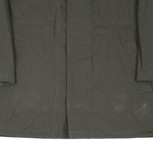 May include: A dark green utility jacket with a button closure and two pockets on each side.