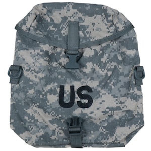 May include: A camouflage-patterned military-style duffel bag with a US patch and adjustable straps.