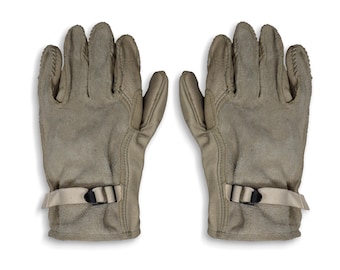 May include: A pair of beige suede work gloves featuring reinforced stitching along the fingers and palms. Each glove includes an adjustable light beige fabric wrist strap with a black plastic buckle closure to ensure a secure fit during use.