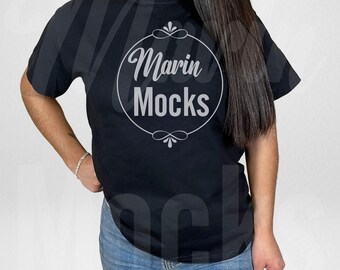 May include: A black t-shirt with a white circle design that says "Marin Mocks" in a decorative font.