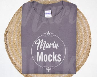 May include: A heather gray t-shirt with a white circle design that says "Marin Mocks" in a script font.
