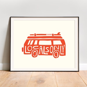 May include: A red illustration of a vintage van with a surfboard on top. The van is made up of the words "Locals Only".