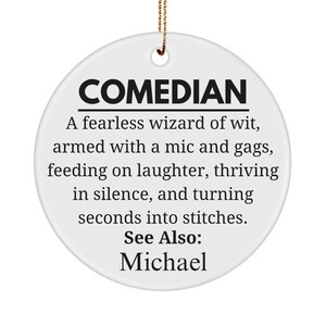 May include: White ceramic ornament with black text that reads "COMEDIAN A fearless wizard of wit, armed with a mic and gags, feeding on laughter, thriving in silence, and turning seconds into stitches. See Also: Michael"