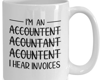 May include: White ceramic coffee mug with black text that reads "I'm an Accountant Accountant Accountant I hear invoices".