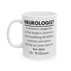 May include: White ceramic mug with the word "NEUROLOGIST" in bold black letters. The mug features text describing a neurologist as a "memory magician" and mentions "86 billion neurons." The mug also includes "See Also: Dr. Williams."