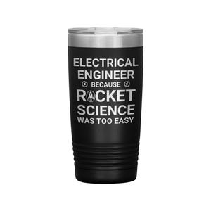 May include: Black insulated tumbler with a silver rim and lid. The tumbler features the text "ELECTRICAL ENGINEER BECAUSE ROCKET SCIENCE WAS TOO EASY" in white, with a rocket ship graphic.