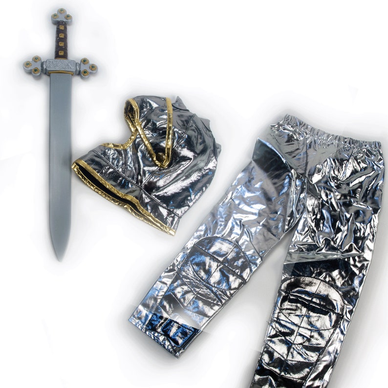 May include: A silver and gold knight costume with a silver sword, pants, and a helmet. The helmet has a gold trim.