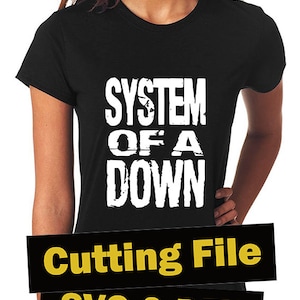 May include: Black t-shirt with white text that reads "SYSTEM OF A DOWN". The text has a distressed look. The t-shirt is being modelled.