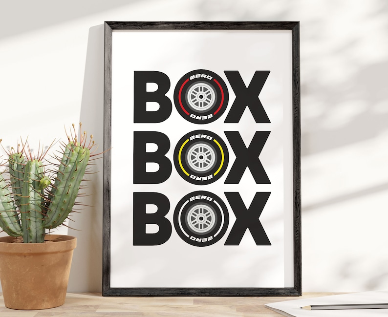 May include: A black and white print with the word "BOX" repeated three times. Each "BOX" is centered above a black and white tire with a red, yellow, or black stripe.