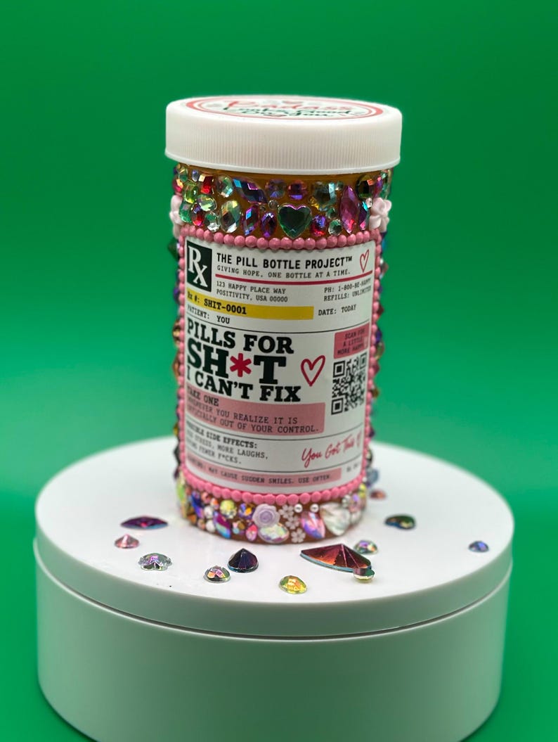 Funny hand-decorated pill bottle covered in rhinestones, reading Pills for Sh*t I Can't Fix