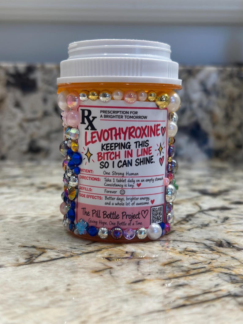 Hand-decorated levothyroxine pill bottle covered in colorful rhinestones and pearls, a funny thyroid warrior gift